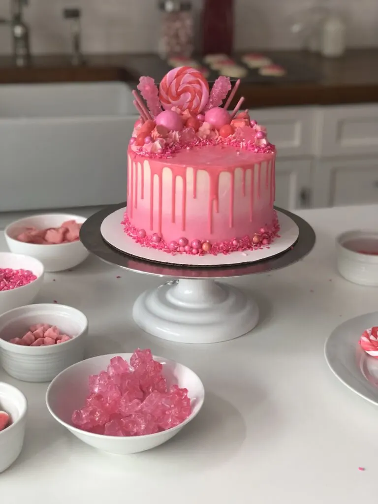 image of a cute pink drip cake decorated with pink candy