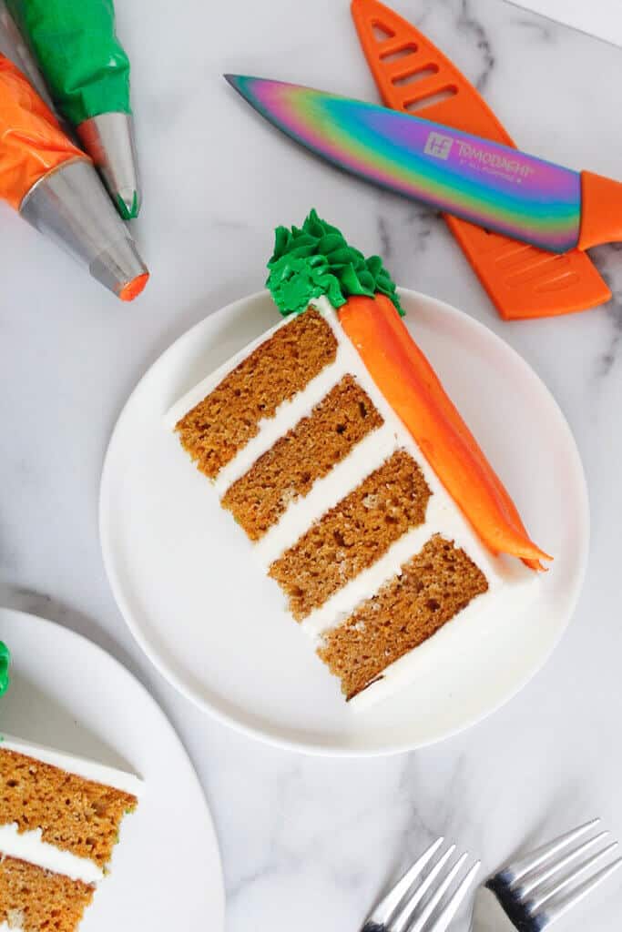 image of slice of carrot cake, frosted with cream cheese frosting
