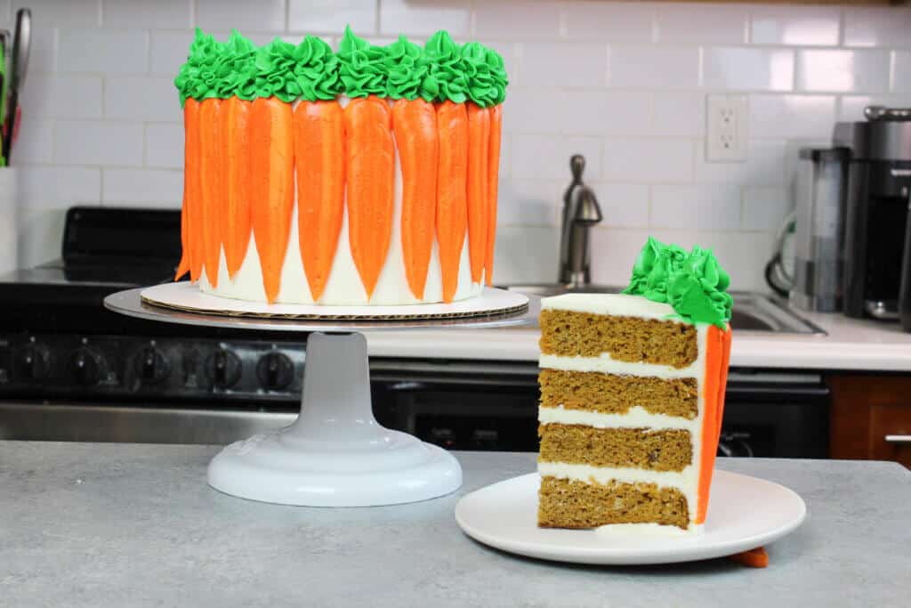 image of a slice of spicy carrot cake decorated with cute buttercream carrots