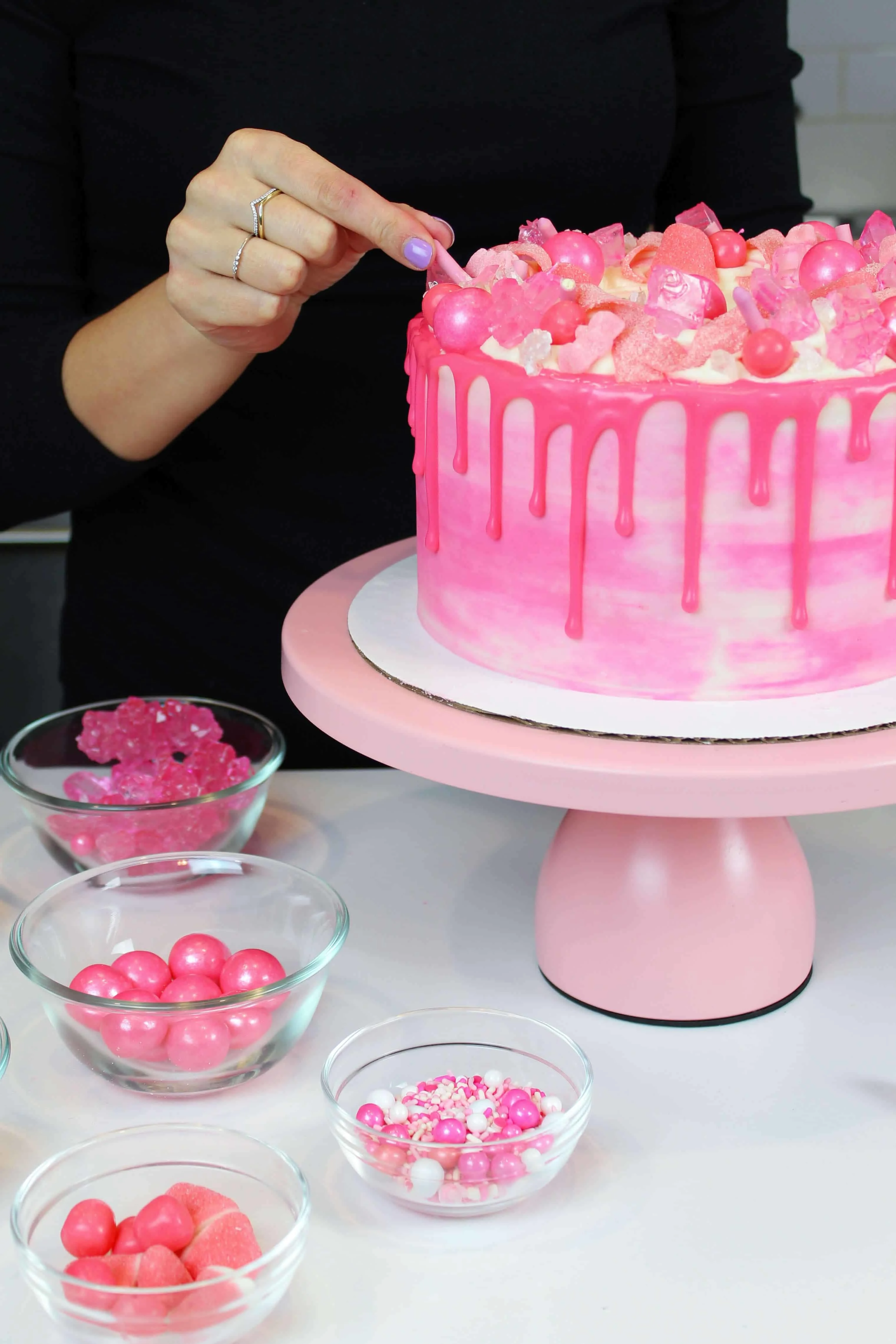 Photo of Pink Drip Cake With Candy