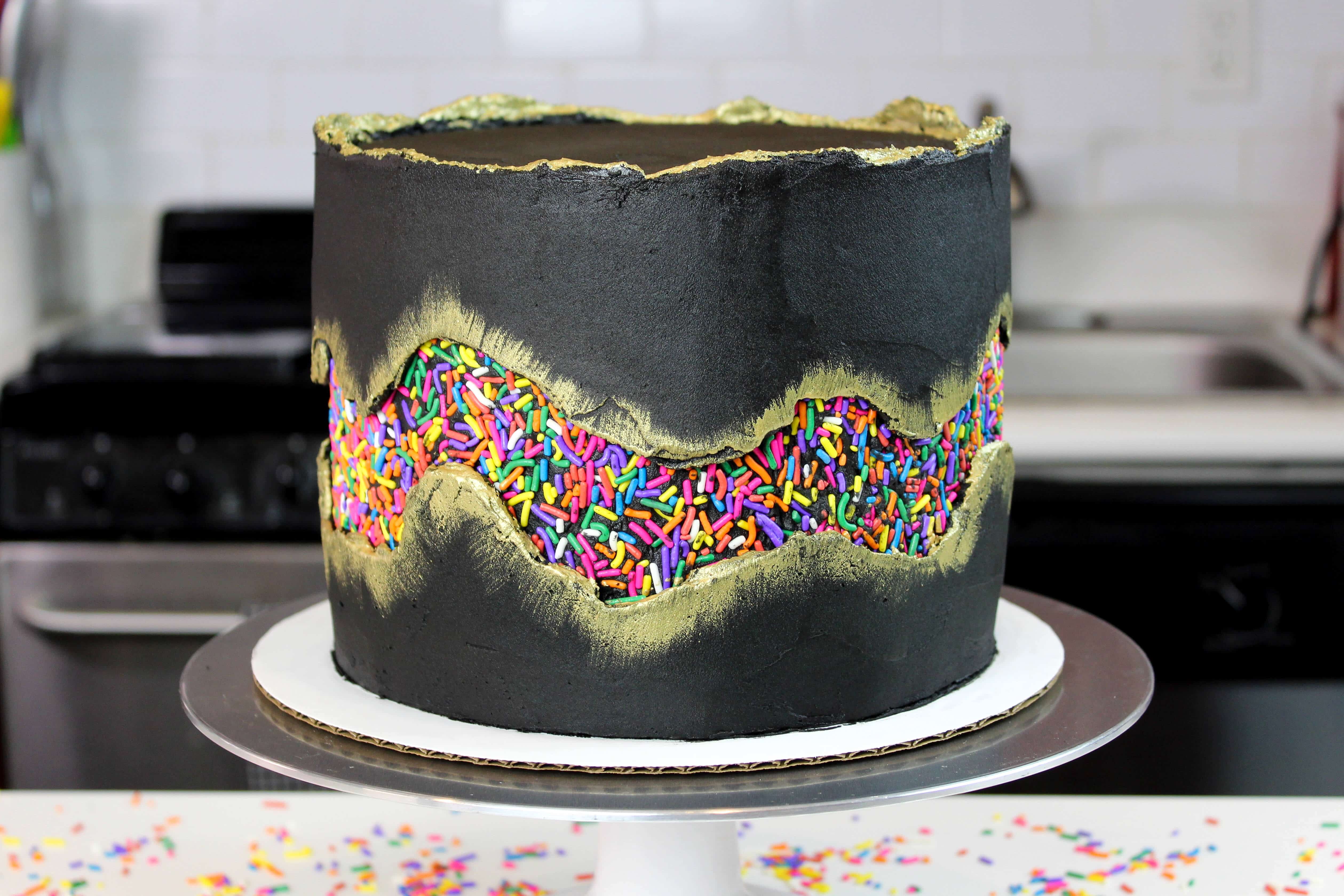 photo of funfetti cake decorated with a sprinkle fault line