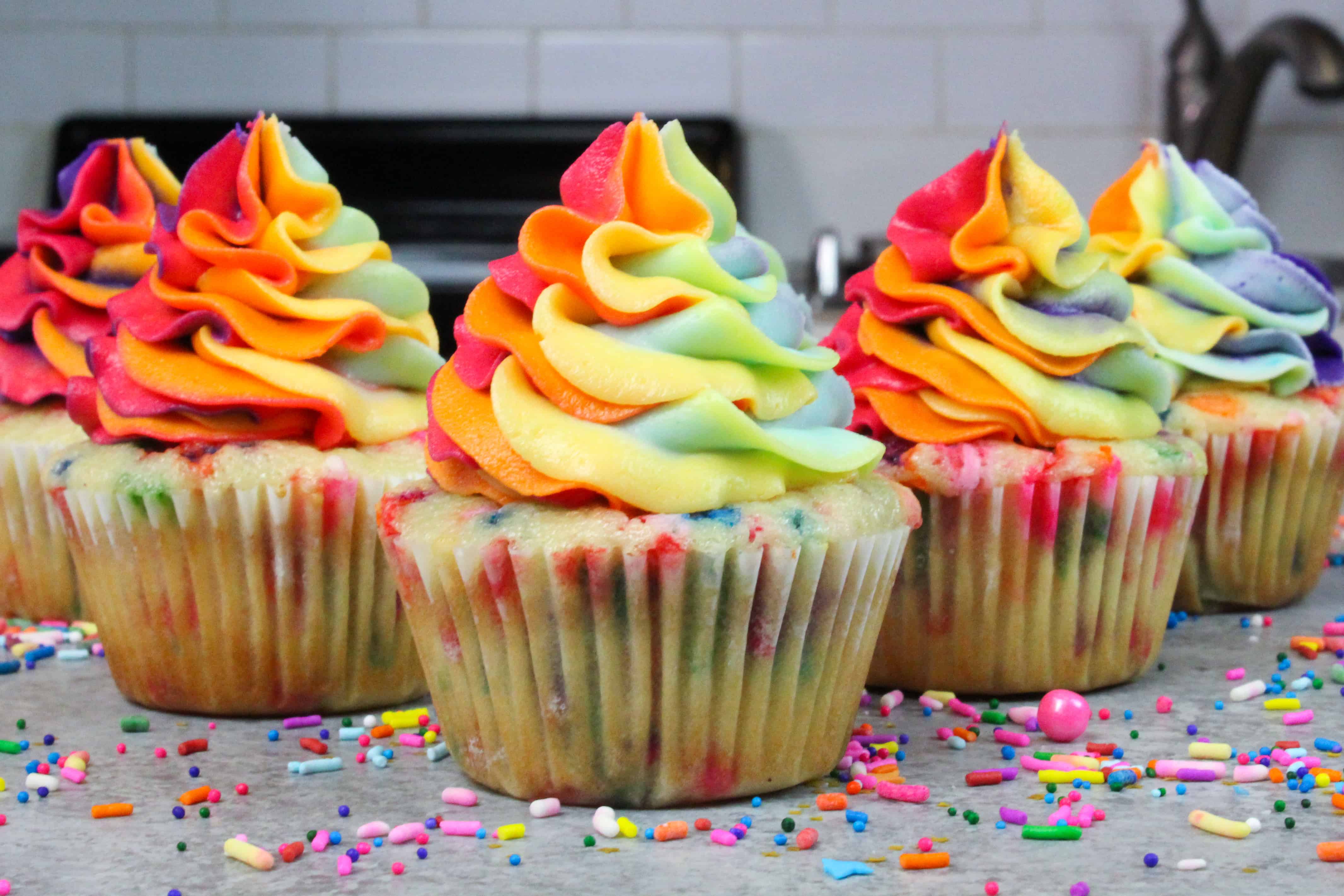 photo of funfetti cupcakes, decorated with rainbow swirled frosting