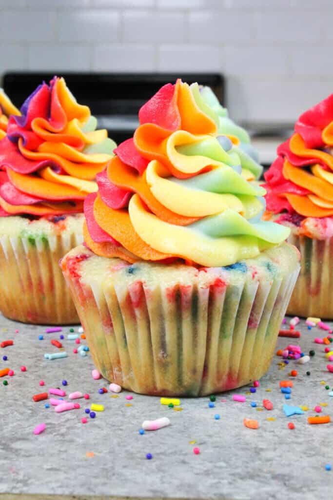 image of funfetti cupcakes decorated with rainbow buttercream