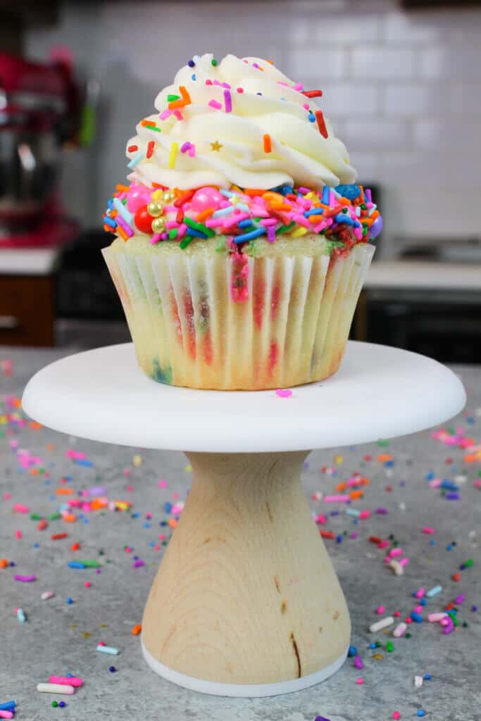 photo of frosted funfetti cupcake, with pretty sprinkle blend