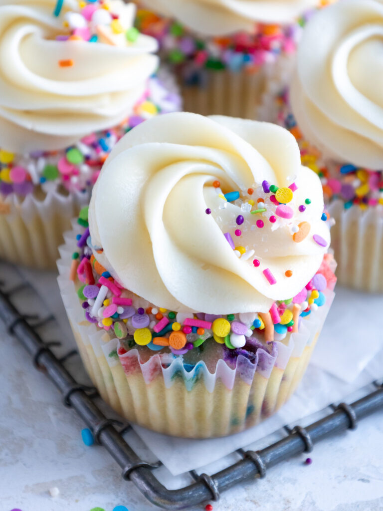 image of a cute funfetti cupcake that's been decorated with sprinkles