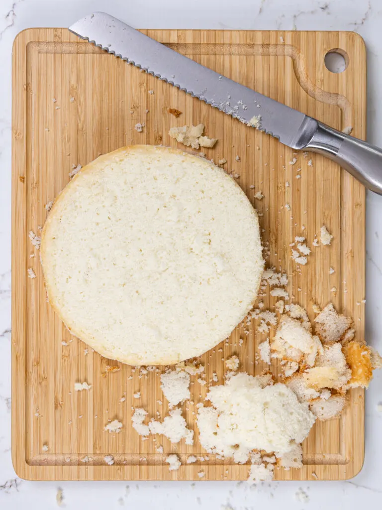 image of an 8-inch WASC cake layer that's been leveled and trimmed with a serrated knife to remove the caramelization