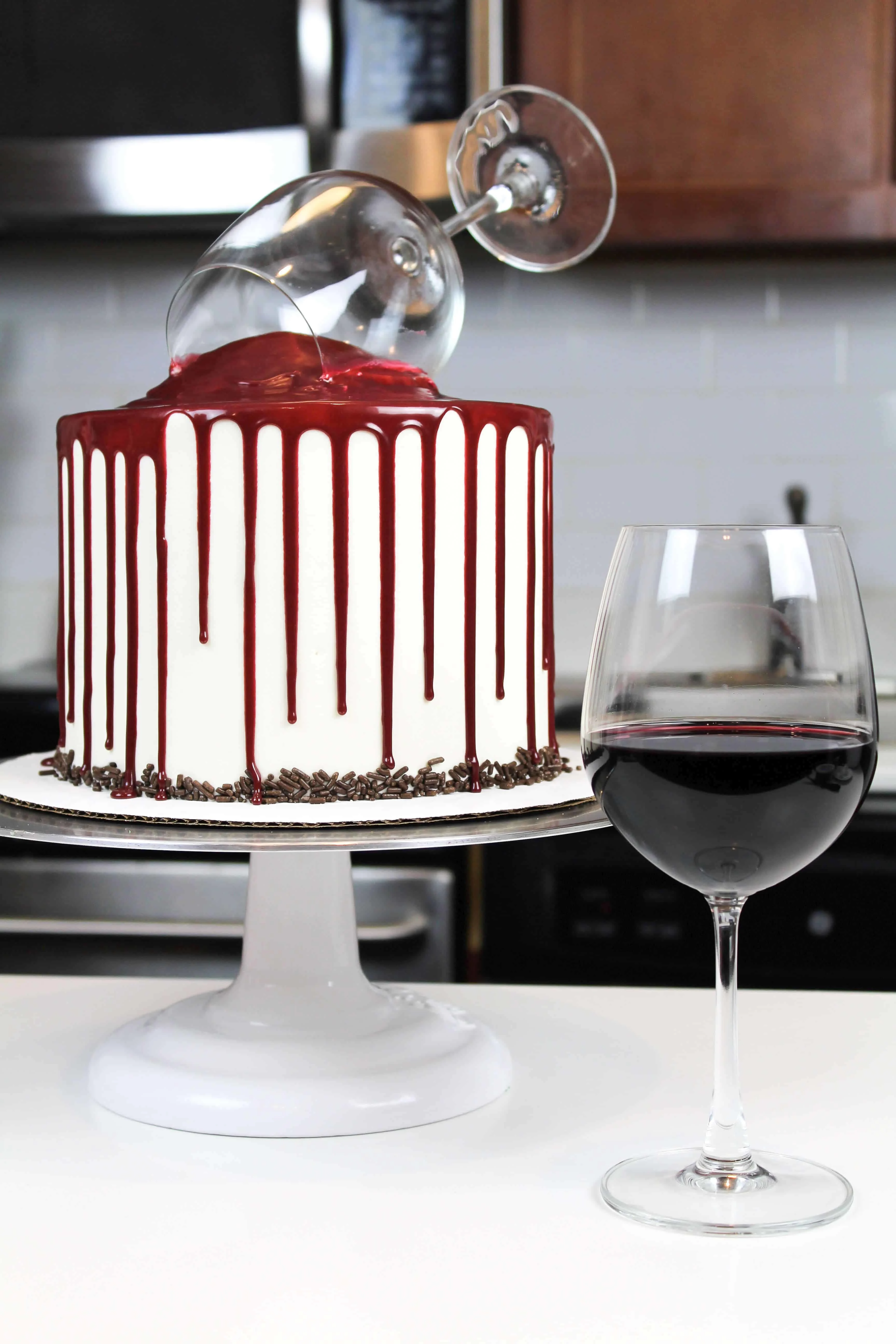Image of a red wine chocolate cake next to a glass of red wine