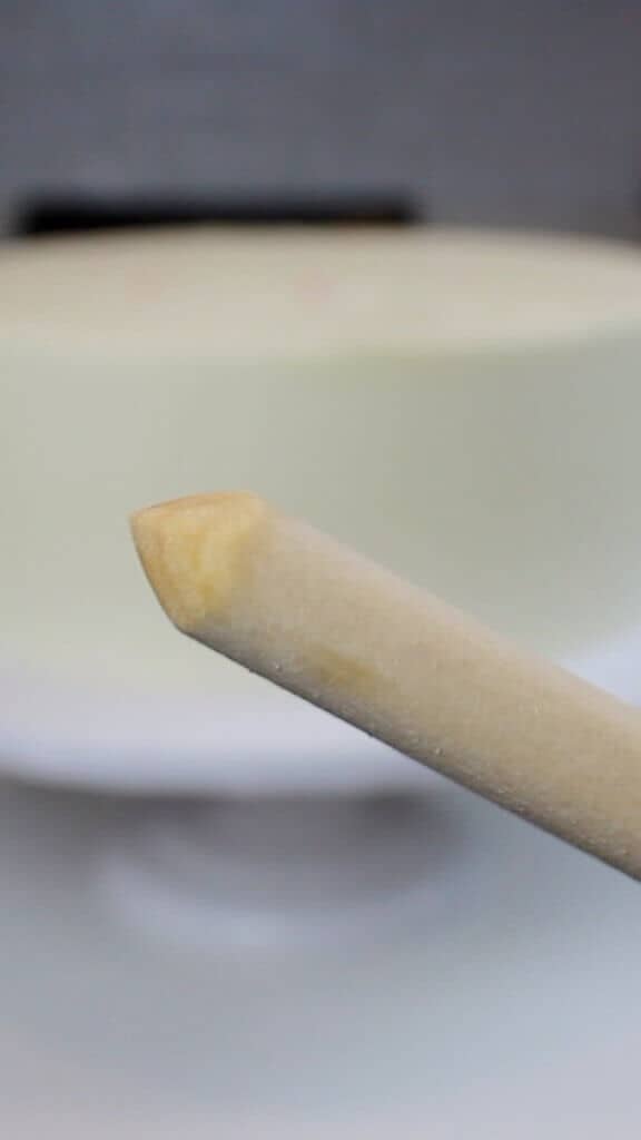 photo of a sharpened central dowel for a wedding cake