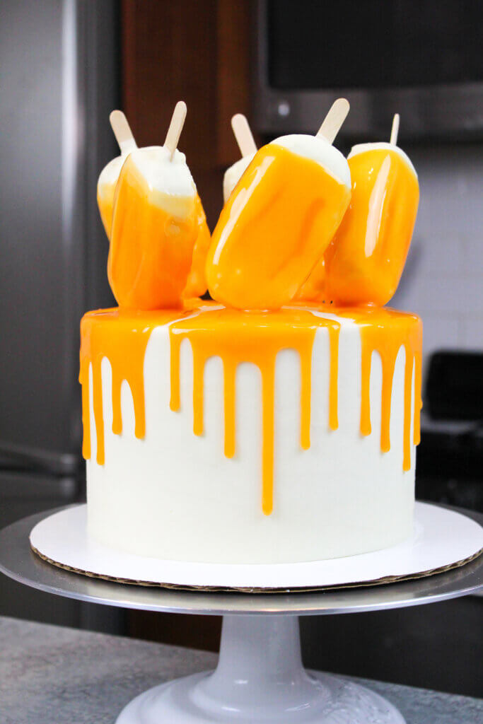 image of finished orange dreamsicle drip cake