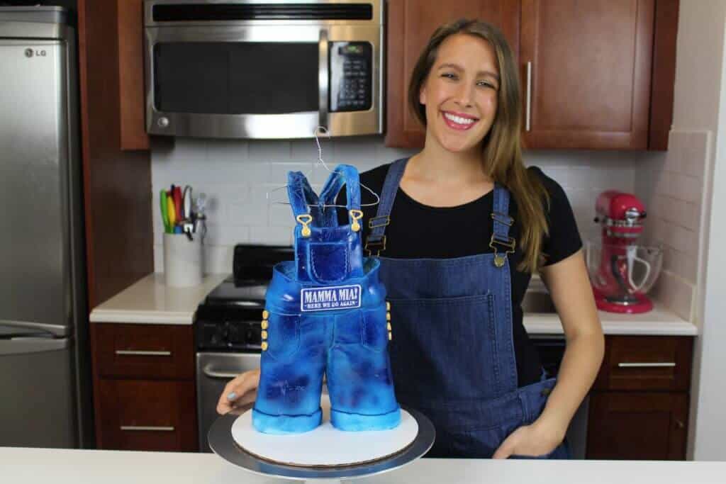 Chelsey White with Mamma Mia Overalls cake