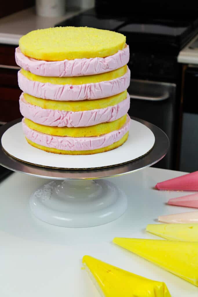 stacked cake with strawberry ice cream and  lemon cake layers