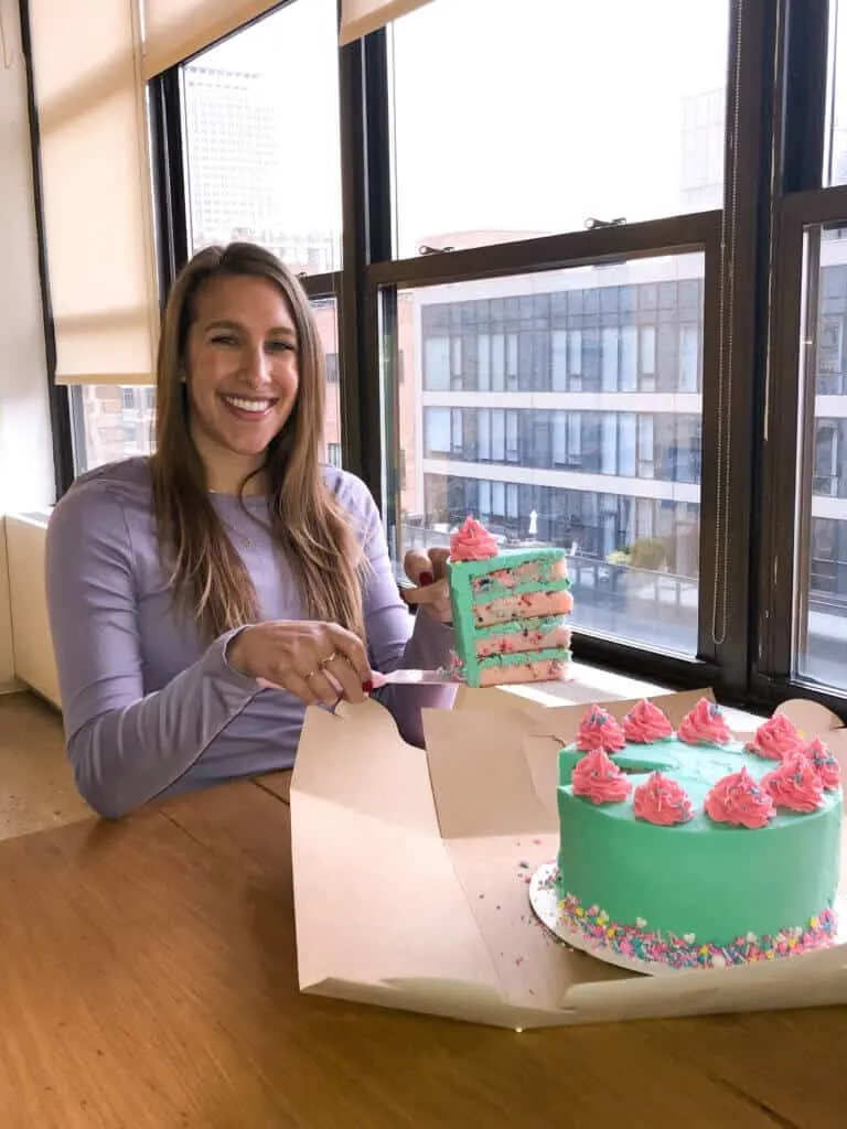 image of chelsey white at edelman office giving away cake