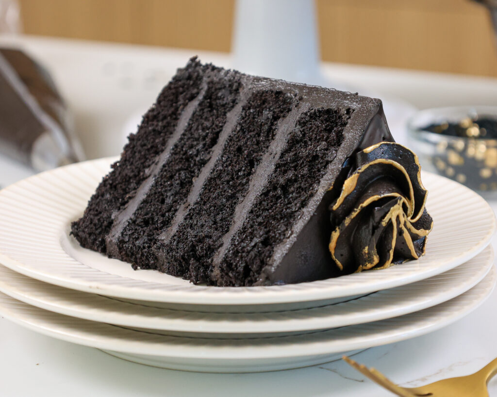 image of a slice of black velvet cake on a plate