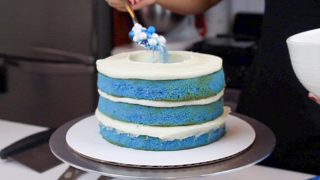 image of adding sprinkles inside a cake to make a surprise inside cake
