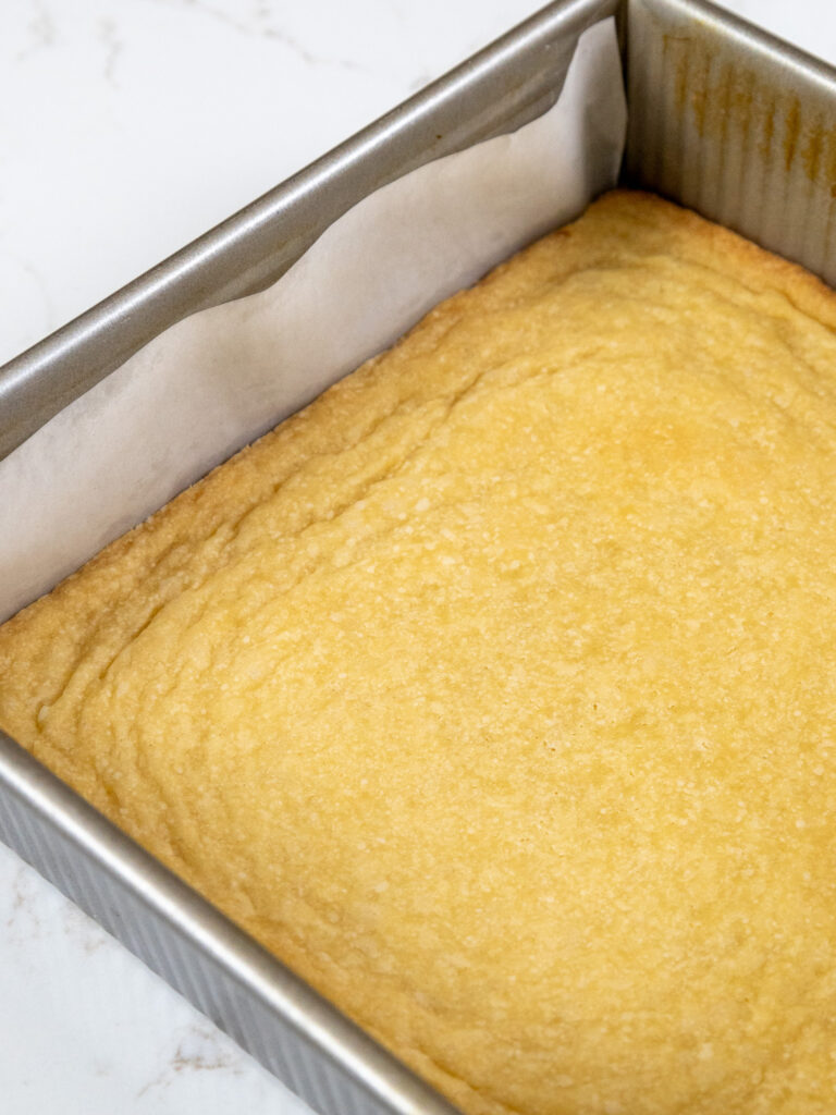 image of a baked shortbread crust that's ready to be used as the base of millionaire bars