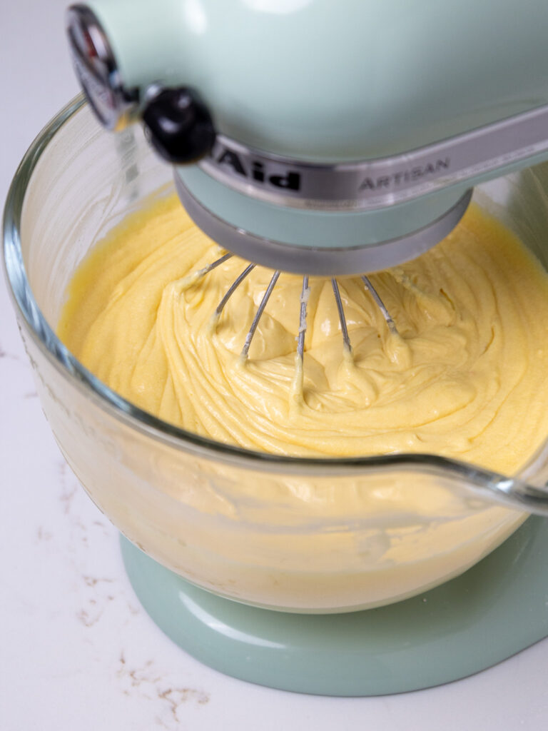 image of yellow cake batter being mixed in a stand mixer