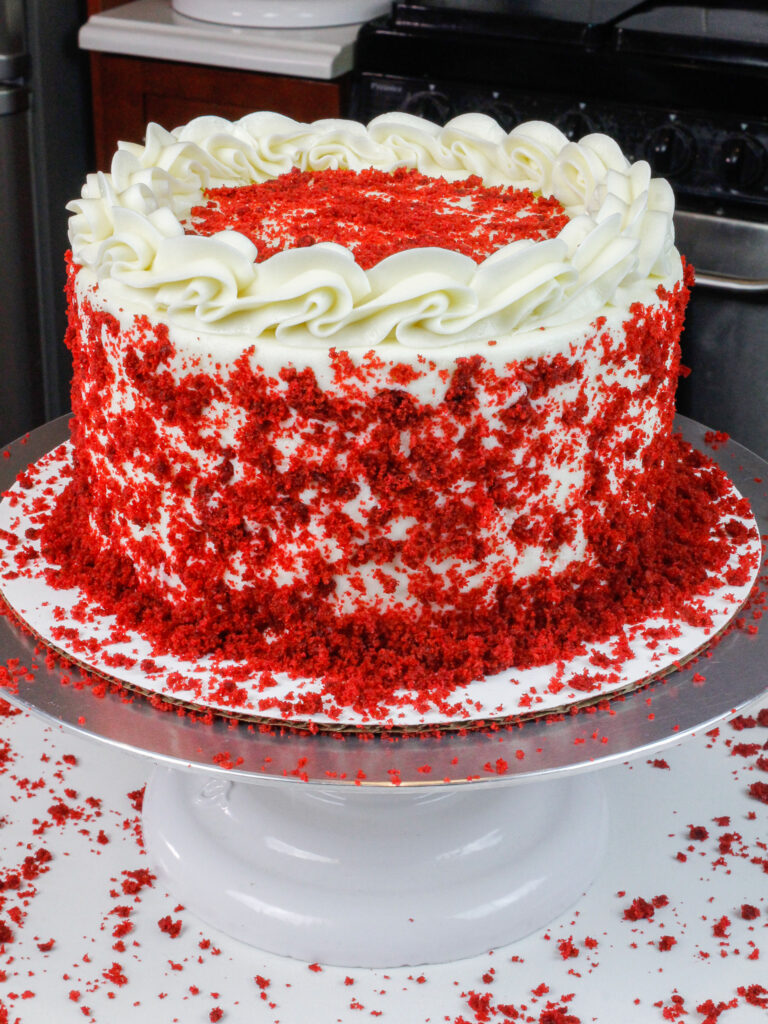image of red velvet cake, decorated with cake crumbs