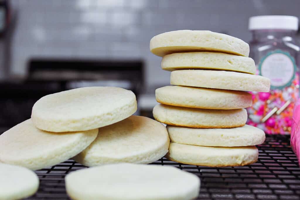 image of cream cheese sugar cookies stacked and baked