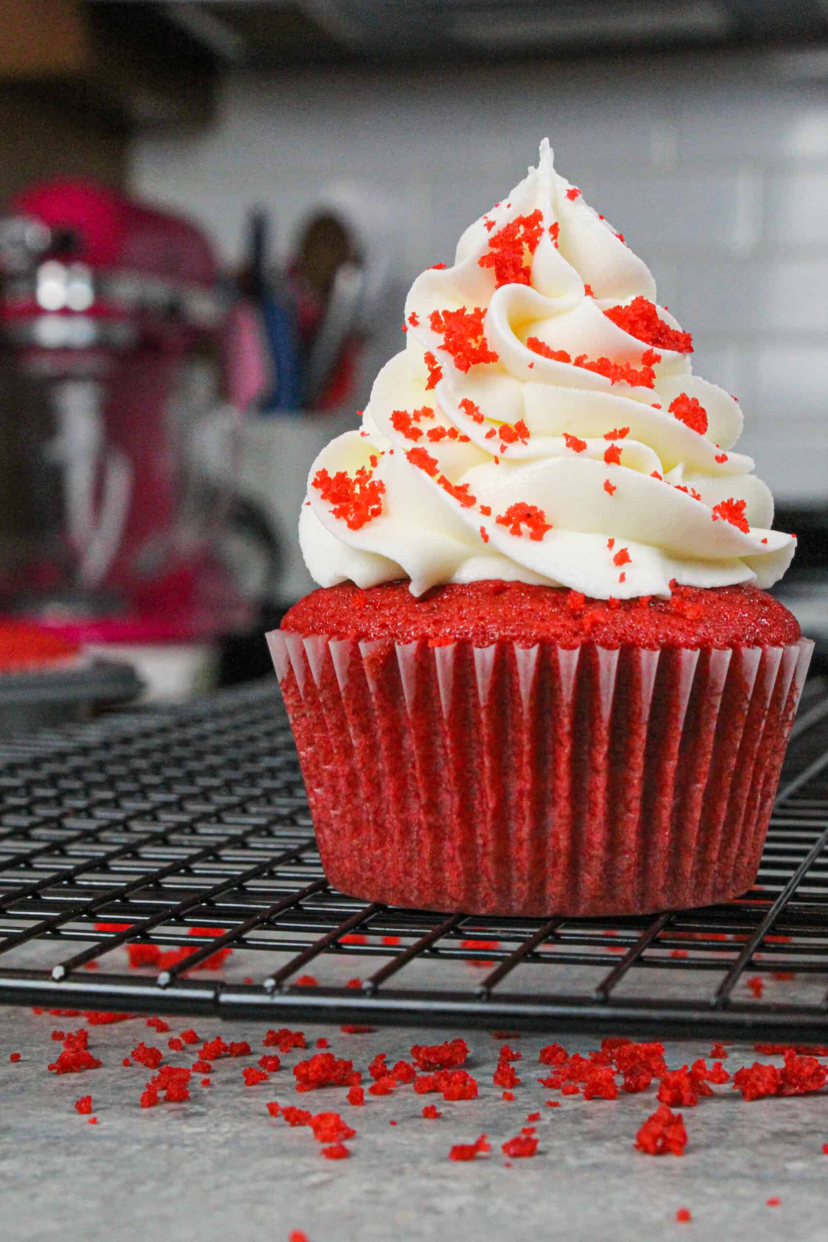 image of beautiful red velvet cupcake, decorated with red velvet crumbs