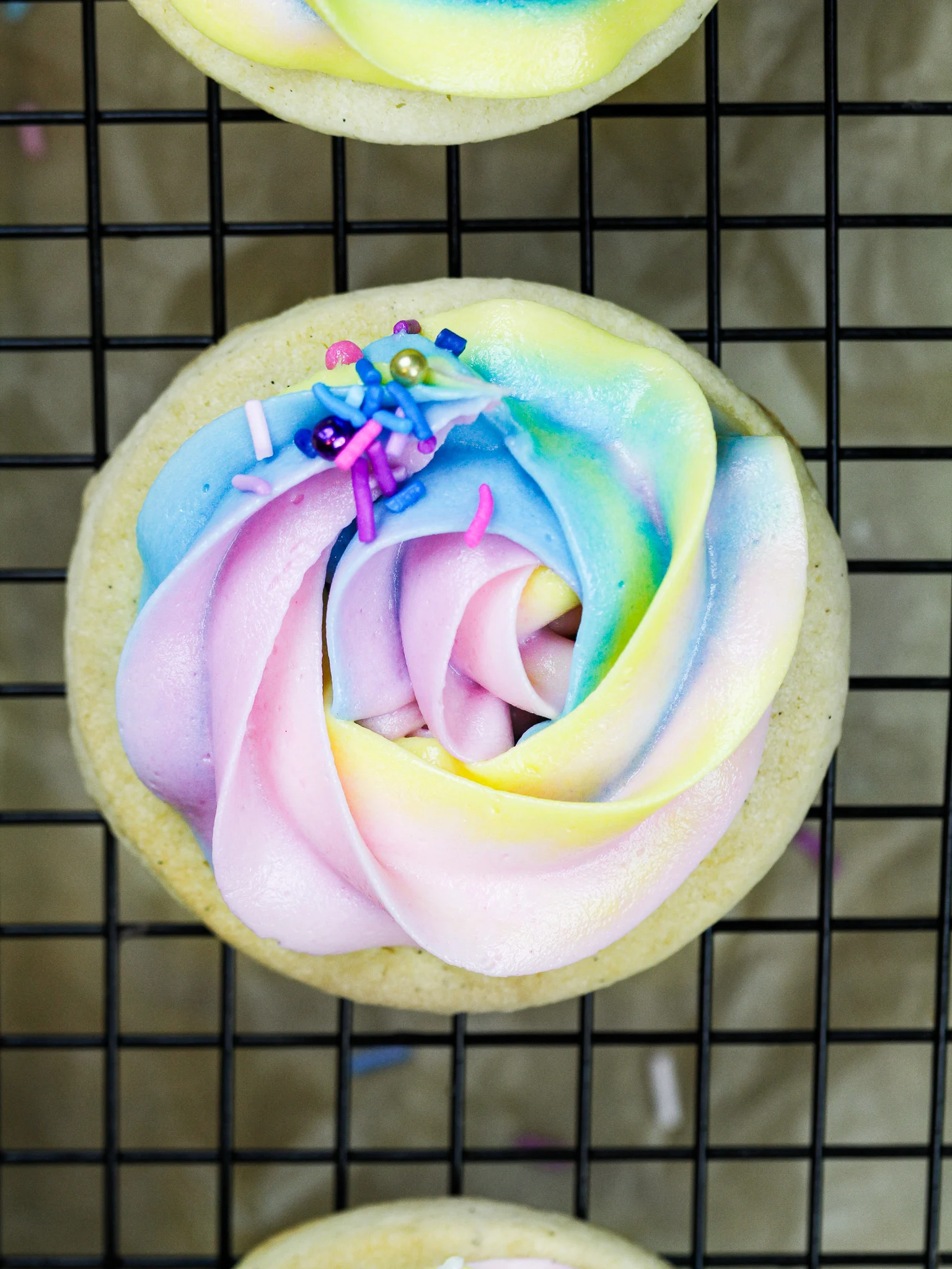 image of a buttercream cookie that's been decorated with colorful buttercream frosting