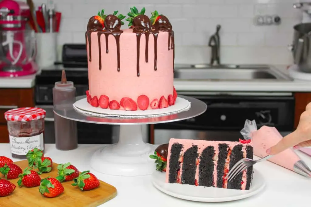 image of dark chocolate strawberry cake with slice cut