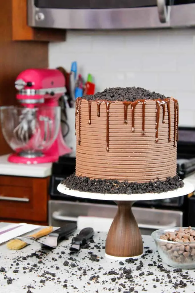 image of chocolate blackout cake covered in chocolate ganache and decorated with a chocolate drip and crumbed cake tops