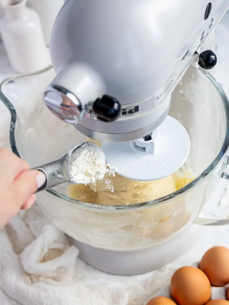 image of flour being added to quick yeast cinnamon roll dough