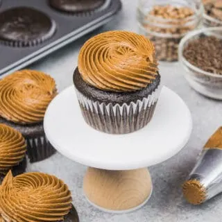 image of gluten free chocolate cupcakes frosted with a swirl of dark chocolate frosting