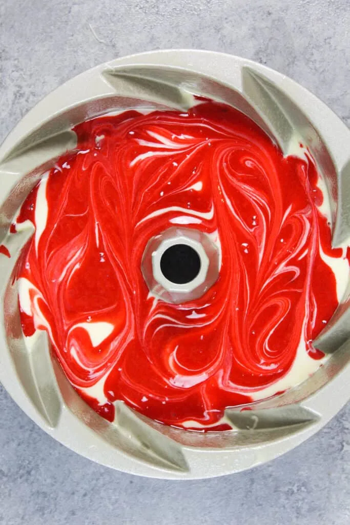 image of red velvet cake batter in a bundt pan