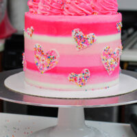 image of small batch funfetti cake decorated with sprinkle hearts