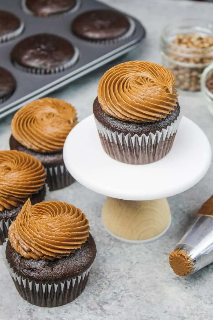 image of gluten free chocolate cupcakes frosted with a dark chocolate buttercream frosting