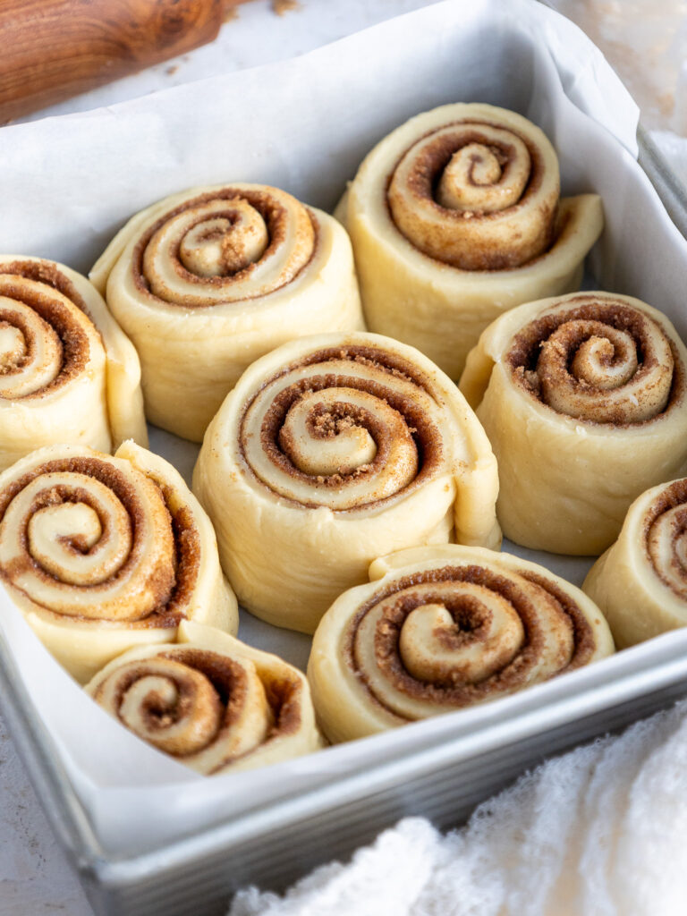 image of quick yeast cinnamon rolls that have been proofed and are ready to be baked