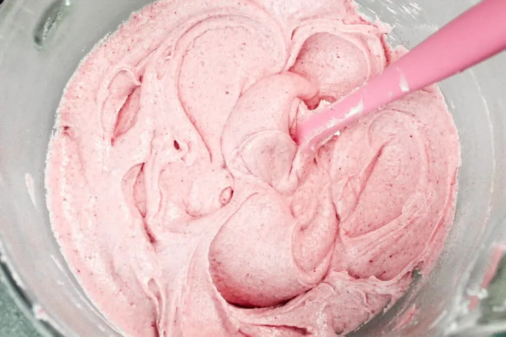 image of raspberry buttercream frosting in a bowl