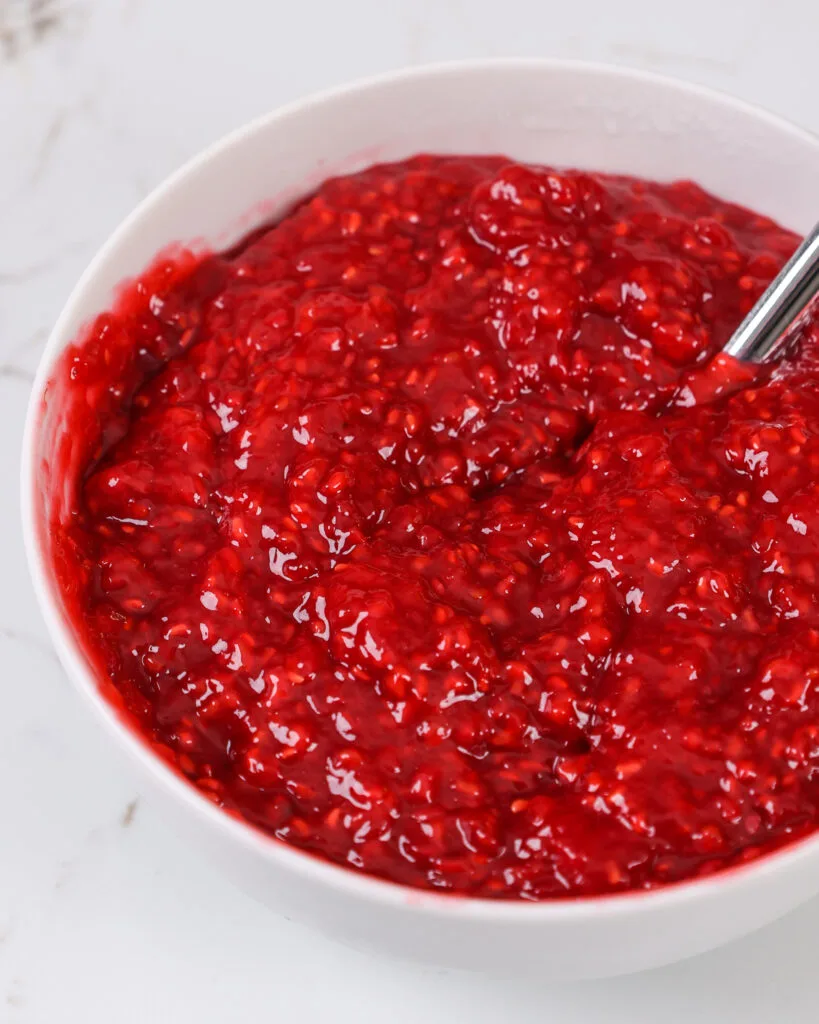 image of raspberry cake filling in a bowl