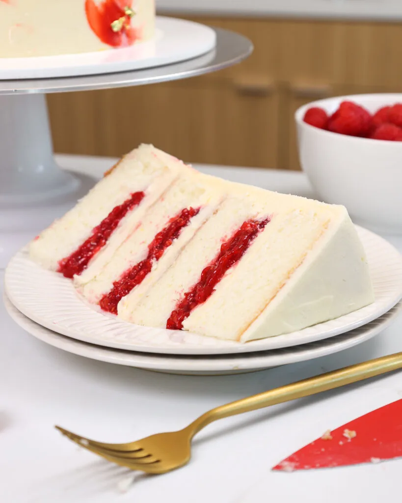 image of a slice of raspberry white chocolate cake on a plate