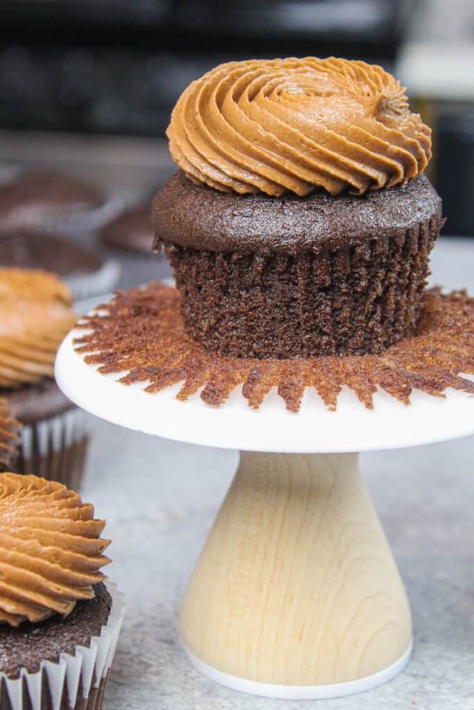 image of gluten free chocolate cupcake unwrapped to show how moist and fluffy the cupcakes are