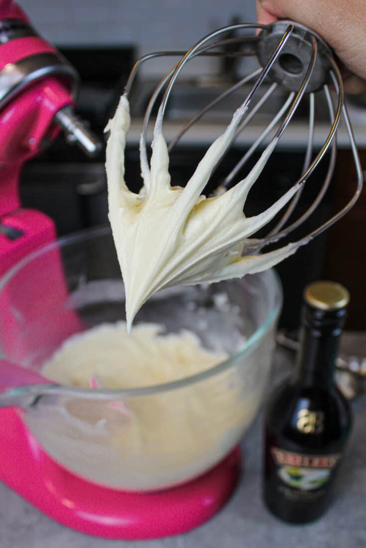 image of baileys frosting on a whisk attachment to show how smooth it is