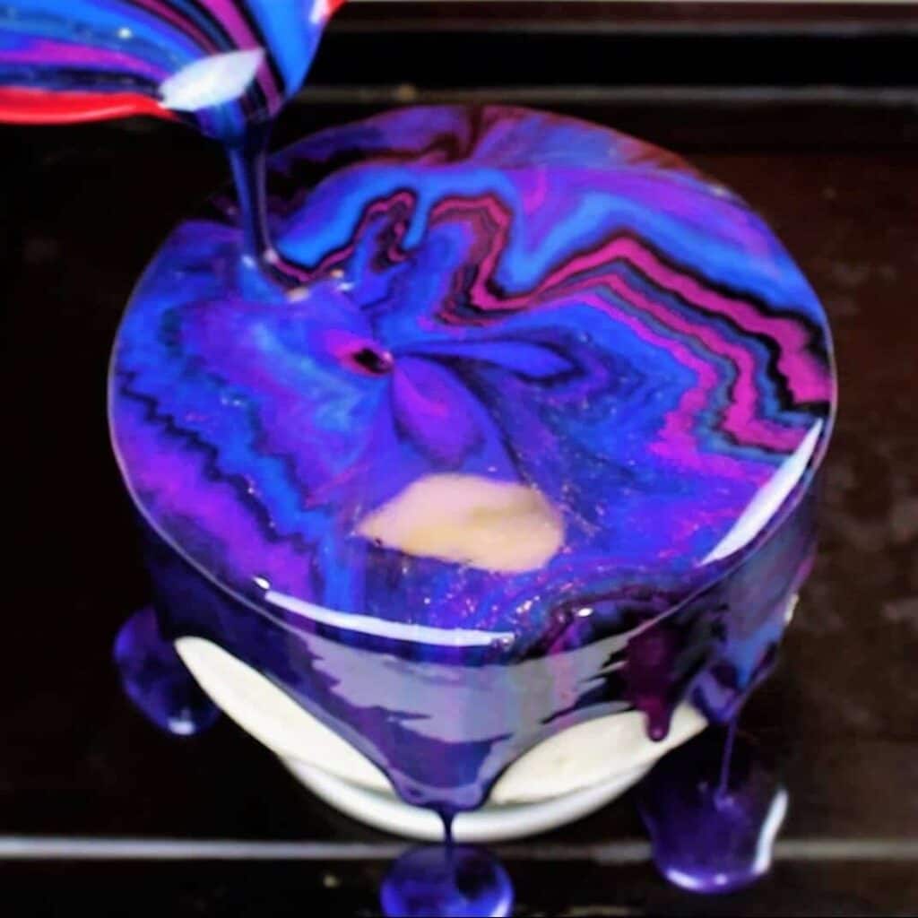 image of galaxy mirror glaze cake made by chelsey white of chelsweets