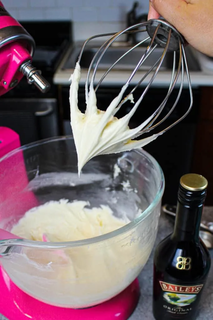 image of baileys frosting on a whisk attachment for a stand mixer