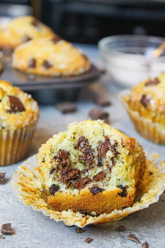 image of bitten into chocolate chip muffin, showing the melted chocolate