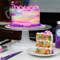 image of vegan confetti cake slice and frosted cake for a birthday