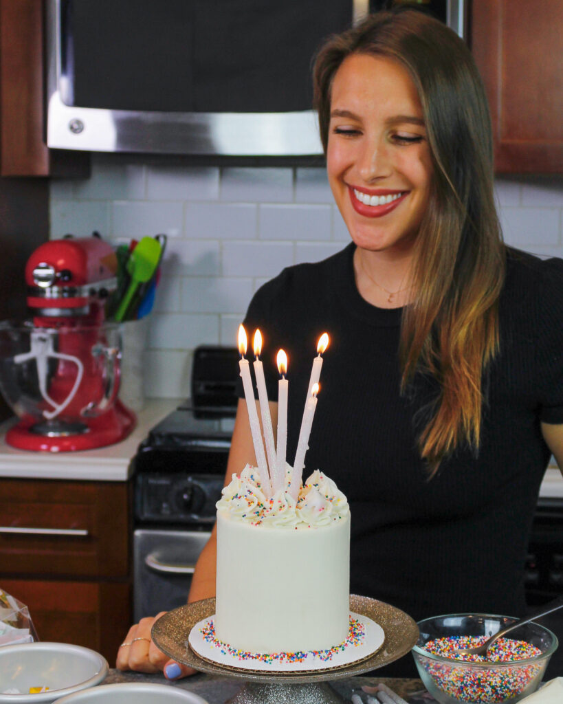 image of chelsweets celebrating with a mini vanilla cake