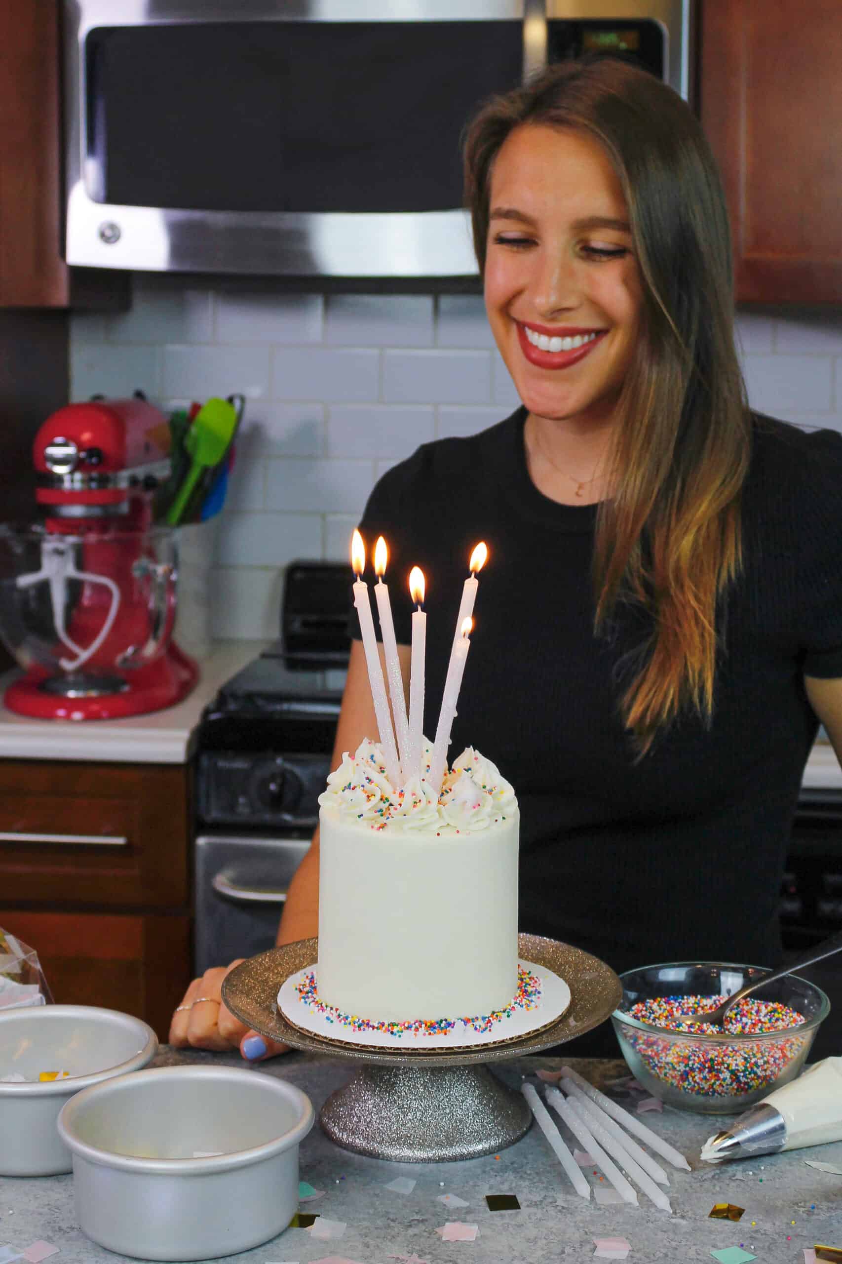 image of chelsweets celebrating with a mini vanilla cake