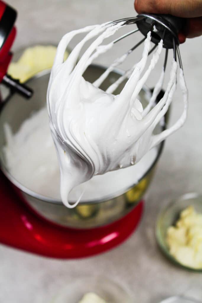 photo of meringue on a kitchenaid whisk attachment, which is about to be turned into swiss meringue buttercream 