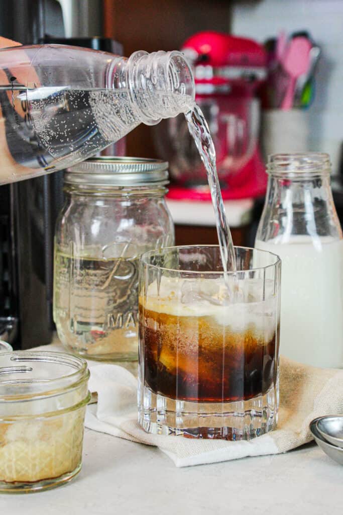 image of club soda being poured into an espresso soda drink
