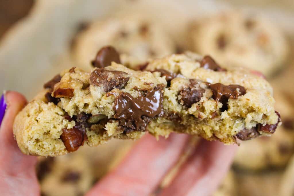 image of a copycat doubletree chocolate chip cookie that's been bitten into to show the melting chocolate inside