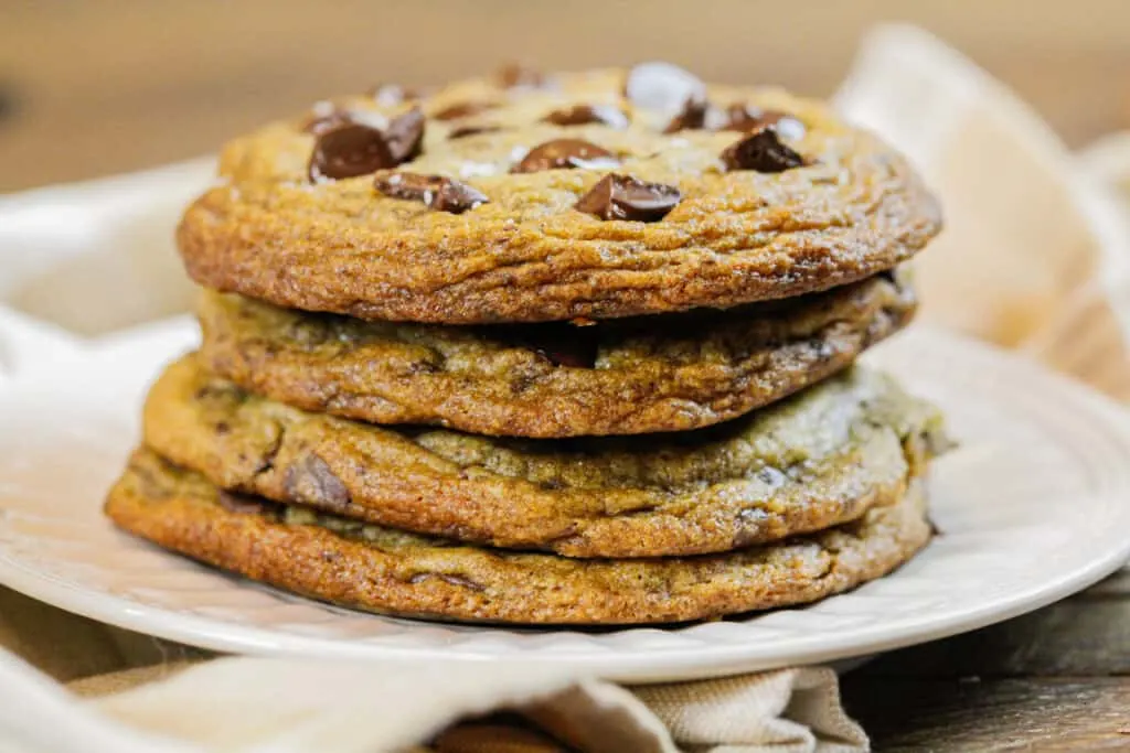 image of stack of brown butter nutella stuffed chocolate chip cookies with golden brown crispy edges