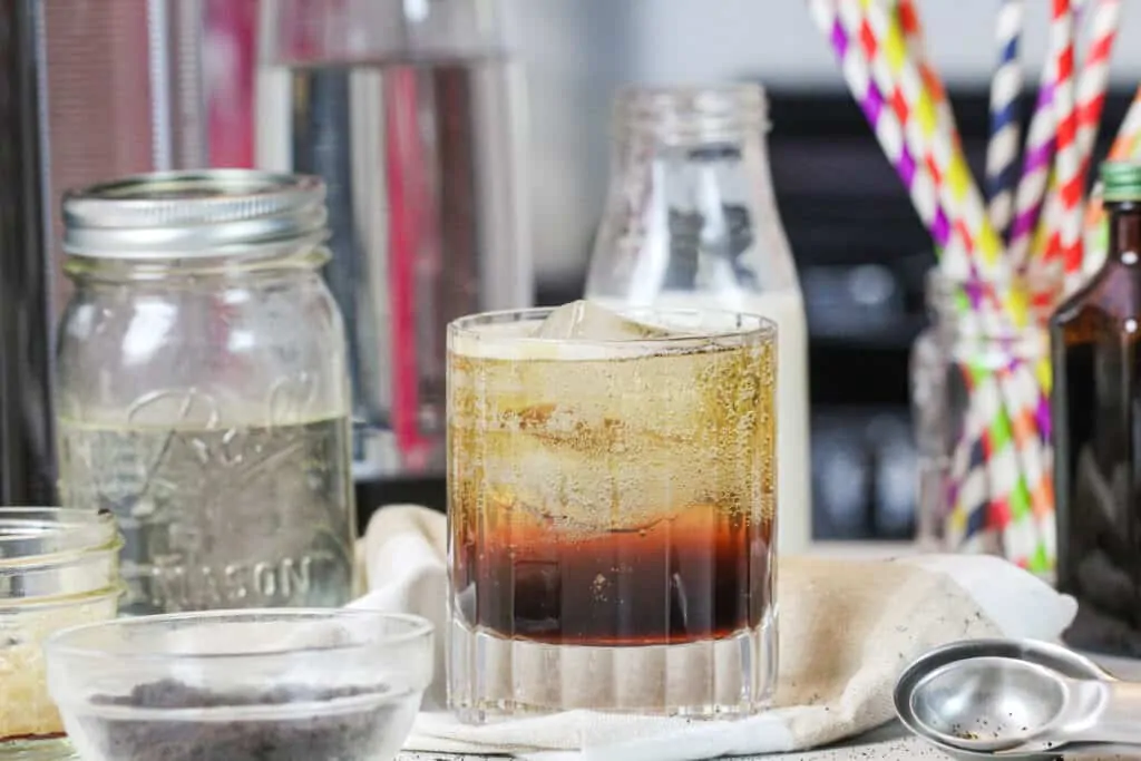 image of espresso soda from a lower angle, showing the levels of the drink with the espresso on the bottom and the club soda on top