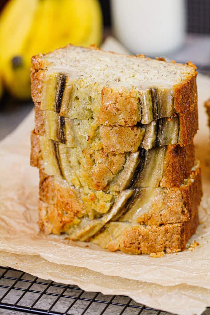 banana bread loaf sliced and stacked to show how pretty and delicious it is
