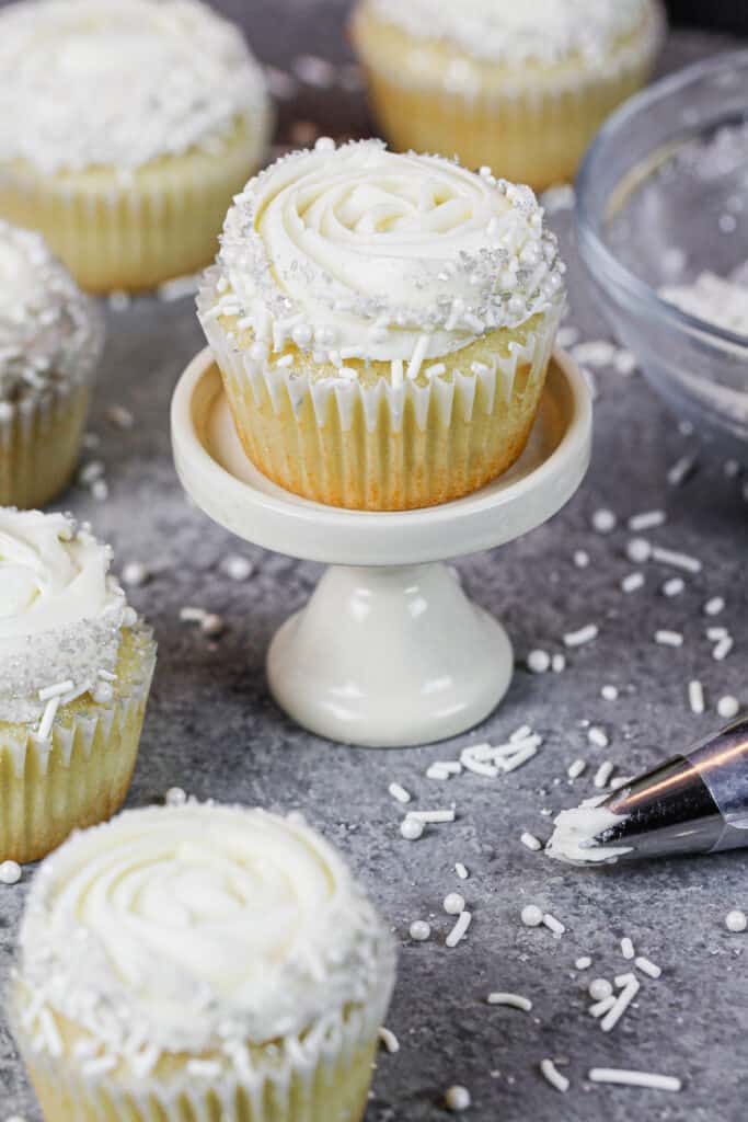 image of almond cupcakes decorated with a buttercream rosette

